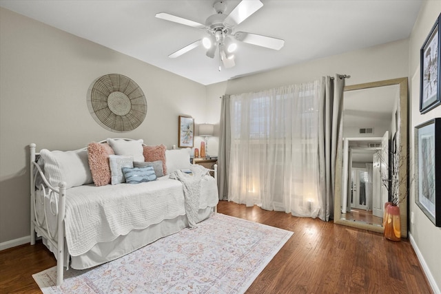 10211 Regal Oaks Dr Unit 121, Dallas, TX 75230 - bedroom with wood finished floors, ceiling fan, and baseboards