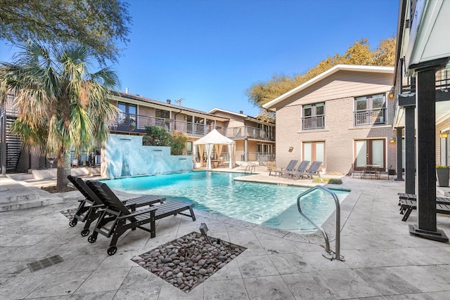 10211 Regal Oaks Dr Unit 121, Dallas, TX 75230 - outdoor pool with french doors and a patio area