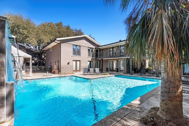 10211 Regal Oaks Dr Unit 121, Dallas, TX 75230 - swimming pool featuring a patio area