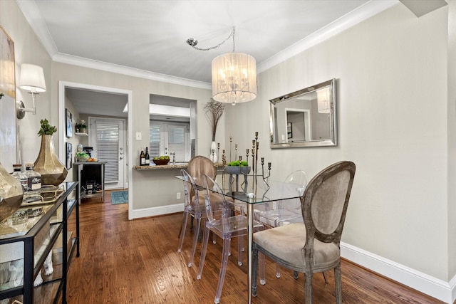 10211 Regal Oaks Dr Unit 121, Dallas, TX 75230 - dining space with baseboards, a chandelier, wood finished floors, and crown molding