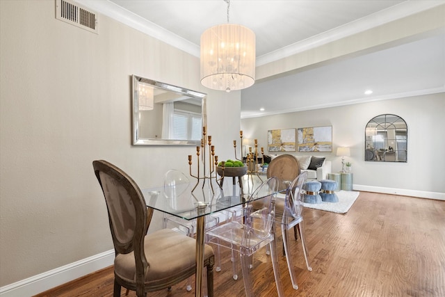 10211 Regal Oaks Dr Unit 121, Dallas, TX 75230 - dining room featuring a chandelier, wood finished floors, ornamental molding, baseboards, and recessed lighting