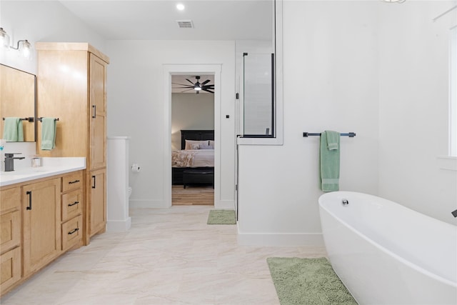 full bathroom featuring visible vents, baseboards, a soaking tub, ensuite bath, and vanity