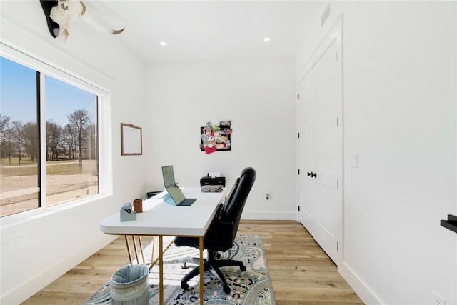 office featuring light wood-style floors, baseboards, and recessed lighting