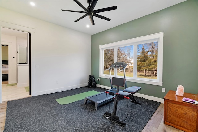 exercise room with light wood-style flooring, baseboards, ceiling fan, and recessed lighting