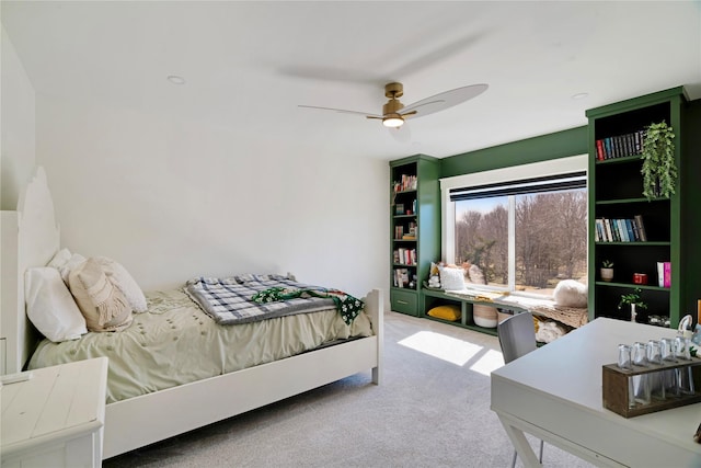 carpeted bedroom with a ceiling fan