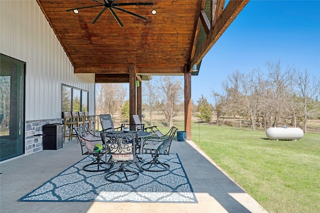 view of patio / terrace featuring outdoor dining area and a ceiling fan