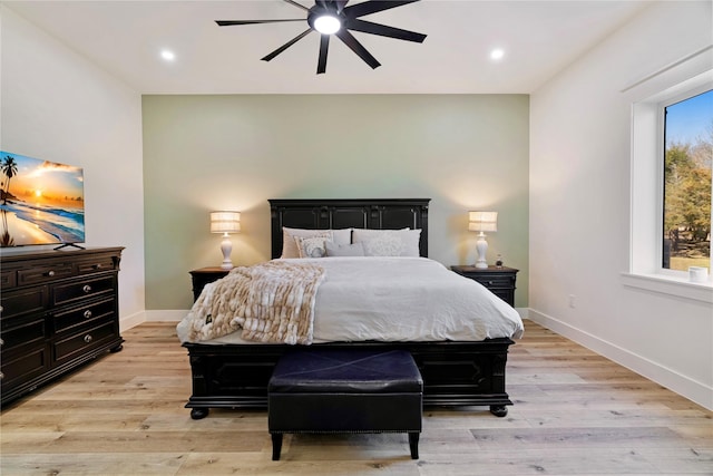 bedroom with light wood-style floors, recessed lighting, and baseboards