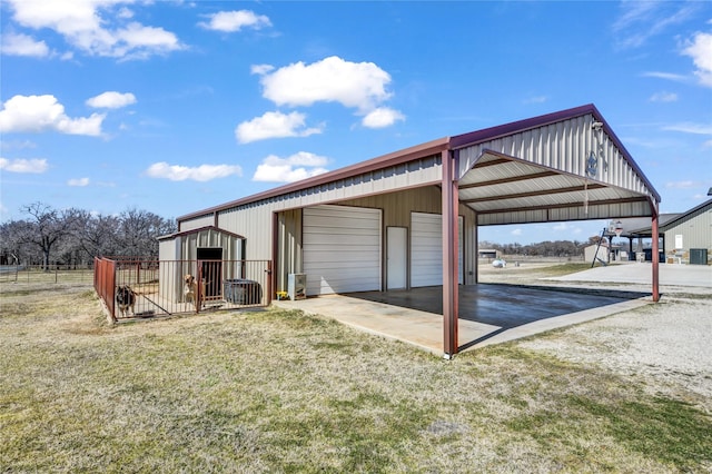 exterior space featuring an outbuilding and fence