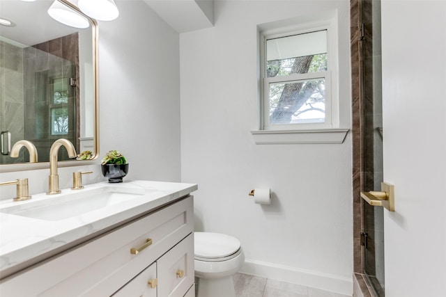 full bath featuring toilet, a shower stall, baseboards, and vanity