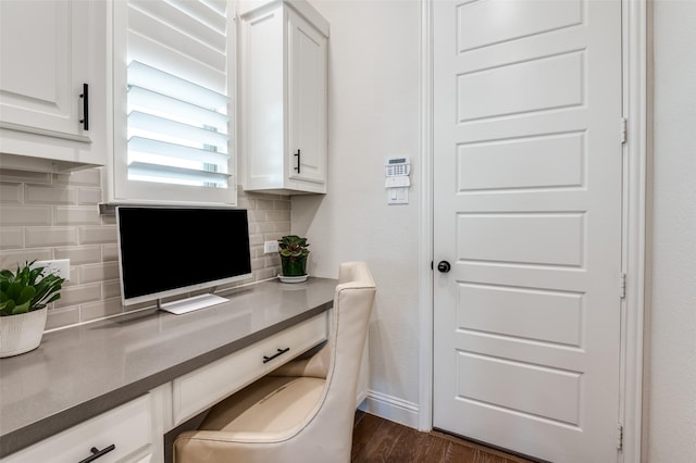 home office with baseboards and dark wood finished floors