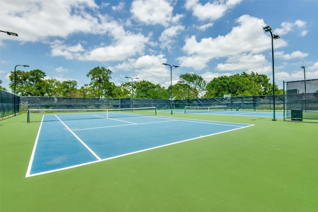 view of sport court with fence