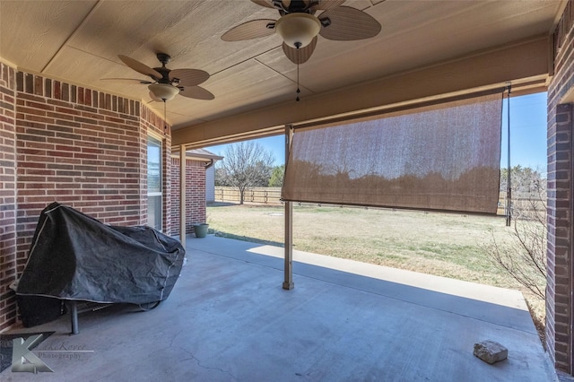 view of patio with a ceiling fan, fence, and area for grilling