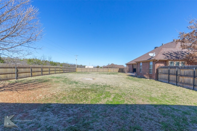 view of yard featuring a fenced backyard