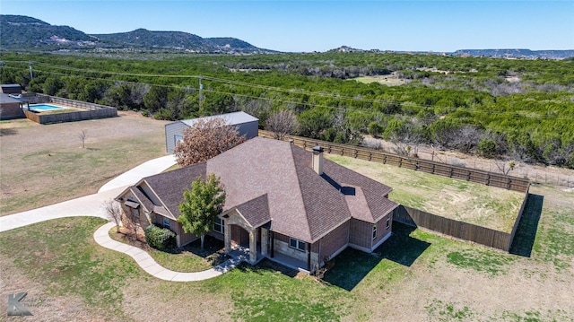 birds eye view of property featuring a mountain view