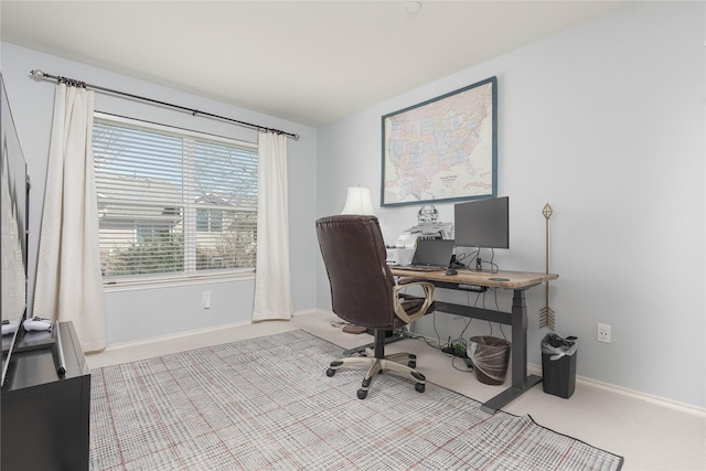 office area with light colored carpet and baseboards