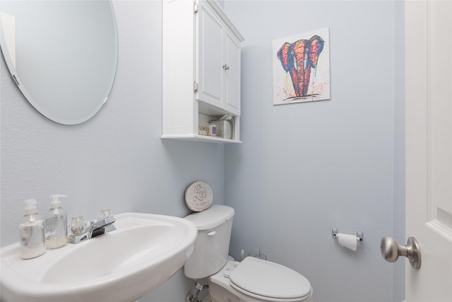 bathroom featuring a sink and toilet