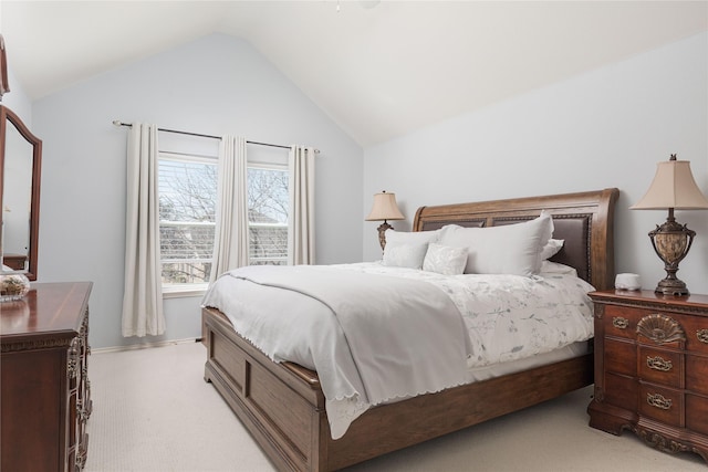 bedroom featuring light carpet and vaulted ceiling