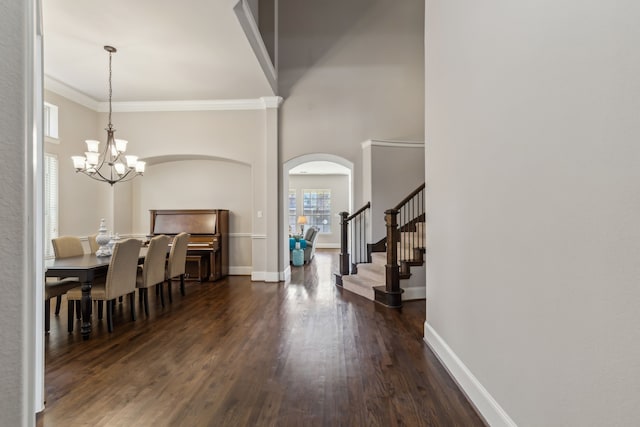 dining space with a chandelier, baseboards, stairs, ornamental molding, and dark wood-style floors