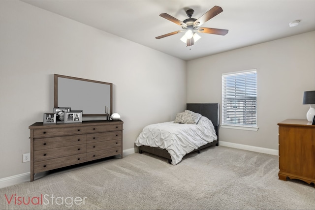 bedroom featuring light carpet, ceiling fan, and baseboards