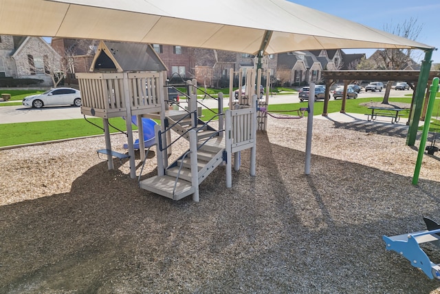 community jungle gym featuring a lawn