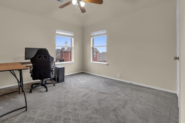 unfurnished office with visible vents, baseboards, ceiling fan, and light colored carpet