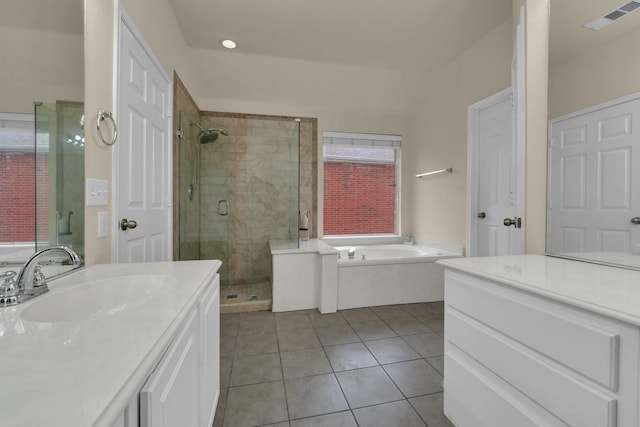 full bathroom featuring a garden tub, visible vents, a stall shower, vanity, and tile patterned flooring