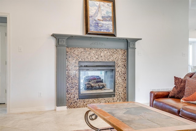 interior details featuring a fireplace and baseboards