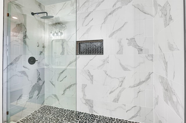 bathroom with tiled shower