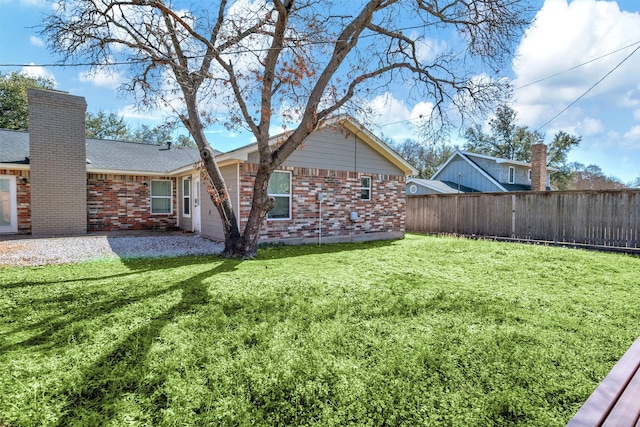 view of yard featuring a patio area and fence