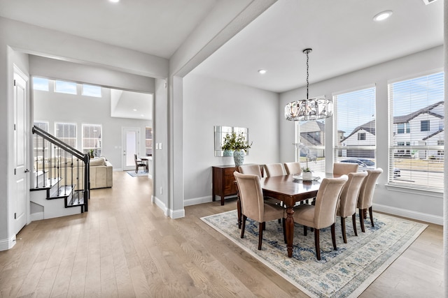 dining area with stairs, recessed lighting, light wood-type flooring, and baseboards