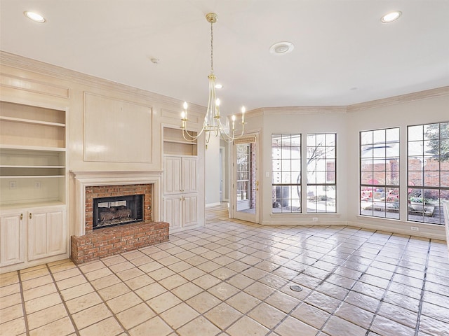 unfurnished living room featuring built in shelves, a notable chandelier, a fireplace, recessed lighting, and ornamental molding