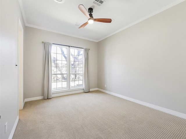 empty room featuring baseboards, crown molding, visible vents, and light colored carpet