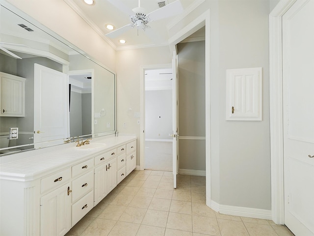 full bath with ceiling fan, vanity, baseboards, tile patterned floors, and crown molding