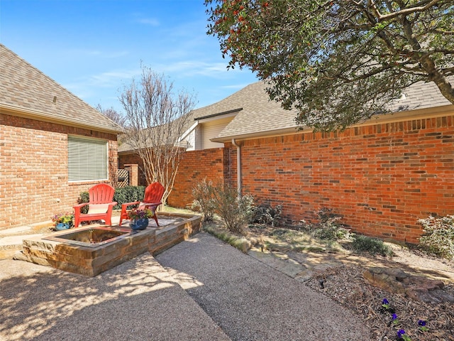 view of patio / terrace featuring a fire pit