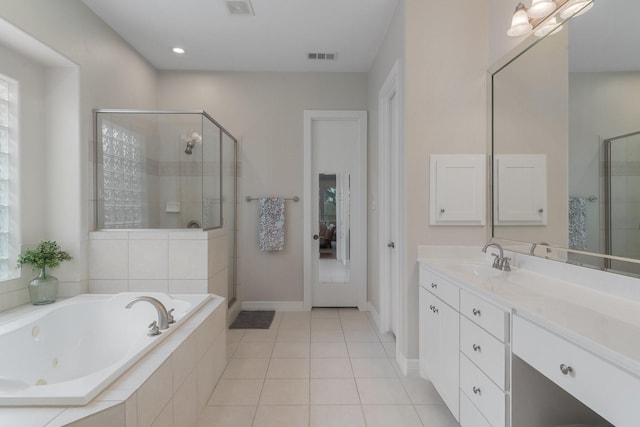 bathroom with visible vents, a stall shower, vanity, a tub with jets, and tile patterned floors