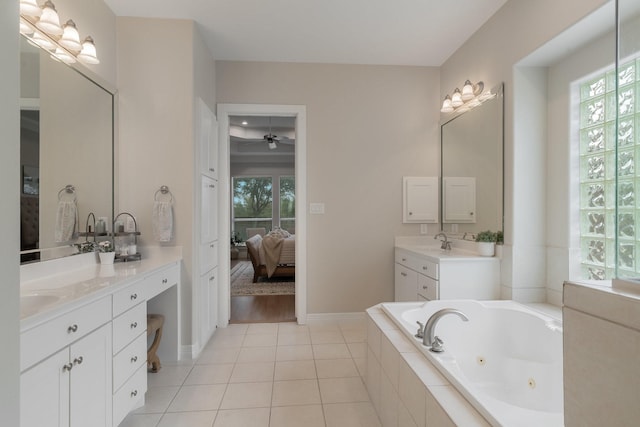 bathroom featuring tile patterned flooring, plenty of natural light, two vanities, and connected bathroom