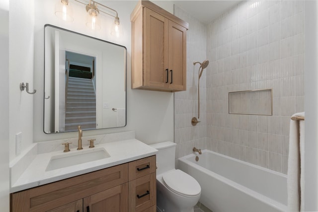 full bath featuring toilet, shower / bathing tub combination, and vanity