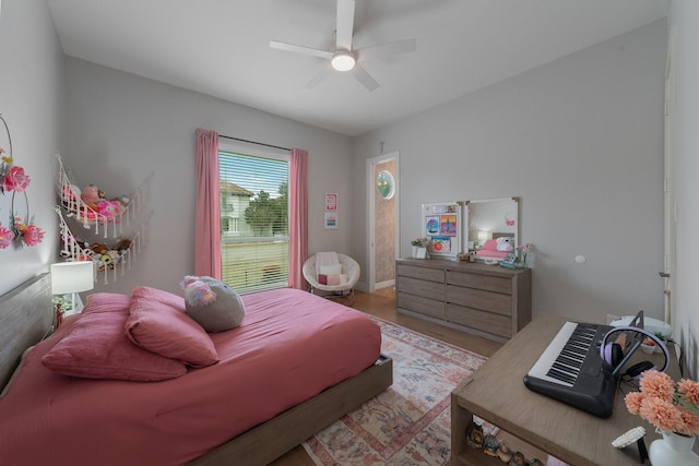 bedroom featuring light wood-type flooring and ceiling fan