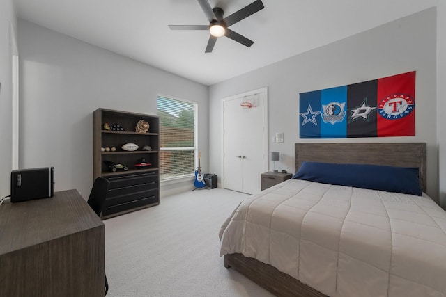 carpeted bedroom with a ceiling fan