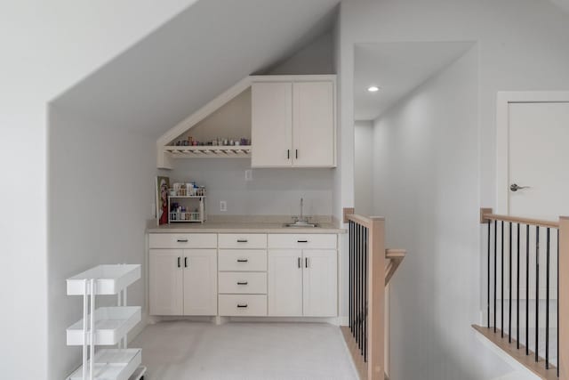 bar with lofted ceiling, indoor wet bar, a sink, and recessed lighting