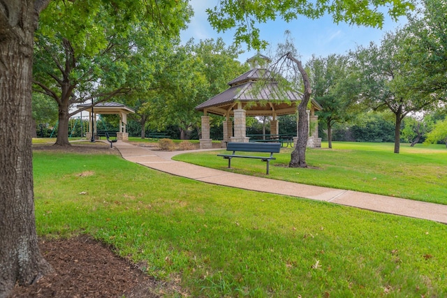 view of property's community featuring a gazebo and a lawn