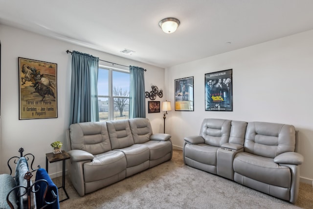 living room featuring light colored carpet, visible vents, and baseboards