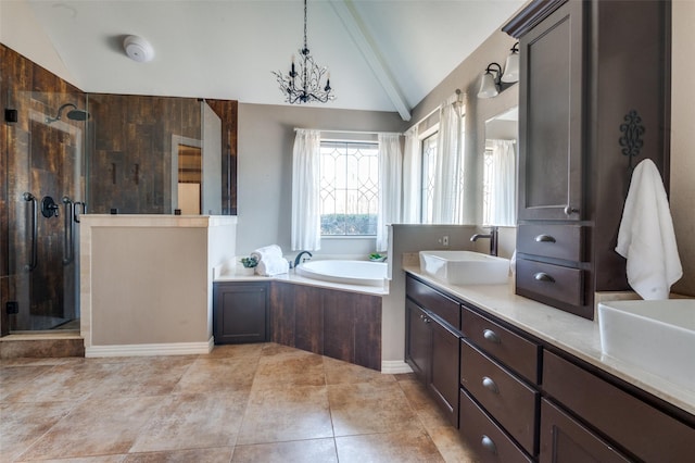 bathroom featuring a garden tub, an inviting chandelier, vaulted ceiling, vanity, and a shower stall