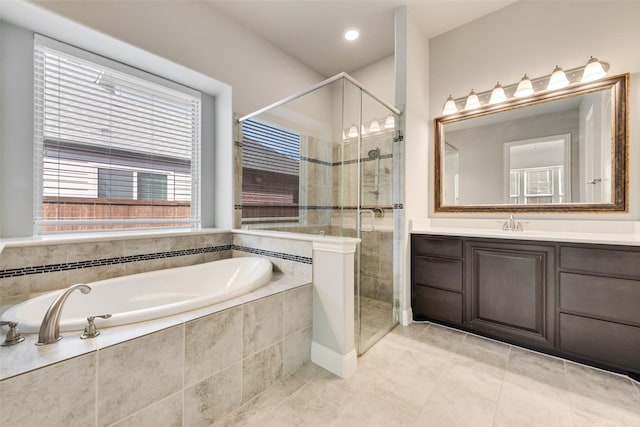 full bath with a stall shower, tile patterned floors, vanity, and a bath