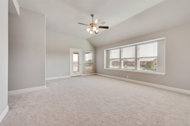 spare room featuring ceiling fan, baseboards, and light colored carpet