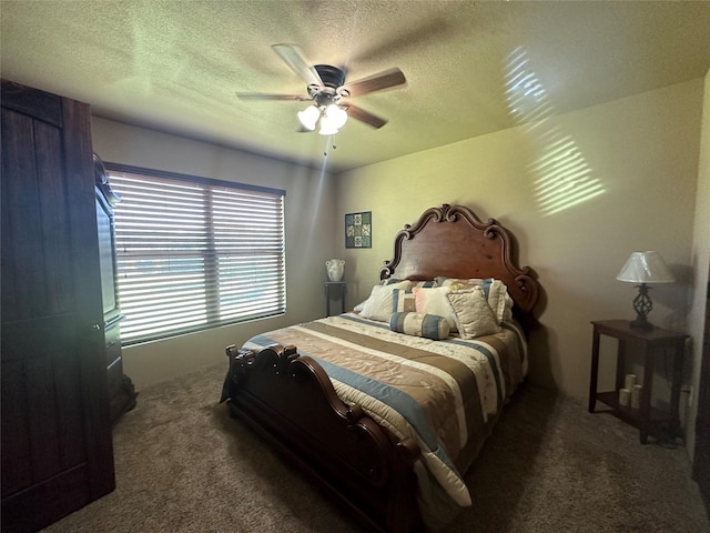 carpeted bedroom with ceiling fan and a textured ceiling