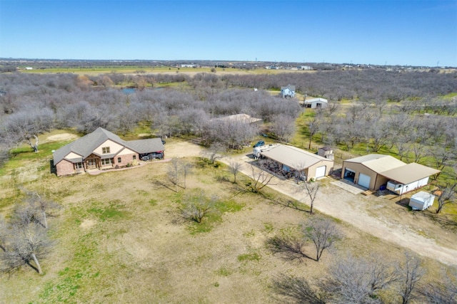 birds eye view of property with a rural view