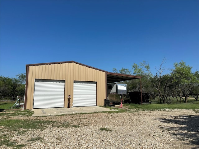 garage with a garage and driveway