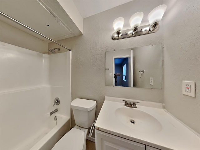 full bathroom featuring a textured wall, vanity, toilet, and shower / bathtub combination