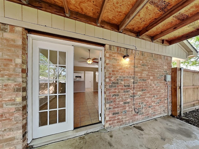 entrance to property featuring brick siding